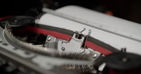 Vintage Black and Red Typewriter with Metal Ruler Close-Up Vídeo Stock 308368003