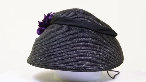 Vintage black straw hat with a artificial violets Stock Footage 313587223