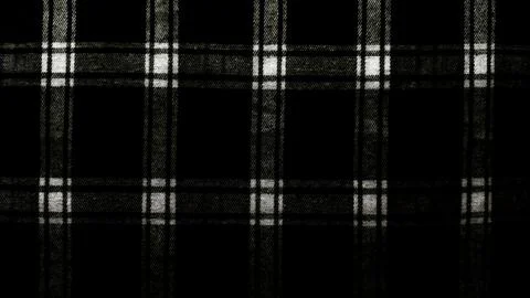 Vintage black white plaid wool fabric texture closeup evoking scottish tartan Foto stock