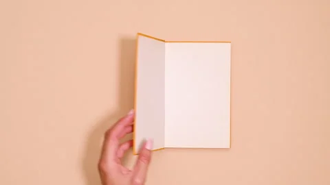 Vintage Book Opens on Vibrant Background Stock Footage 254863902