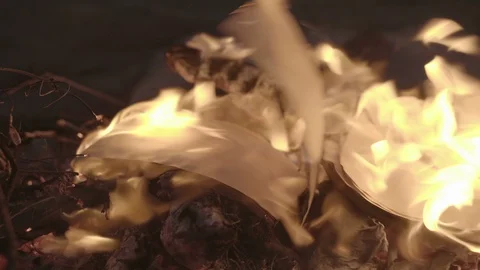 Vintage book page burning in fire flame at night Stock Footage