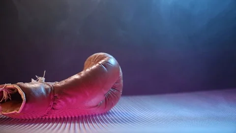 Vintage Boxing Gloves Falling On The Abstract Surface. Vídeo Stock 124252255