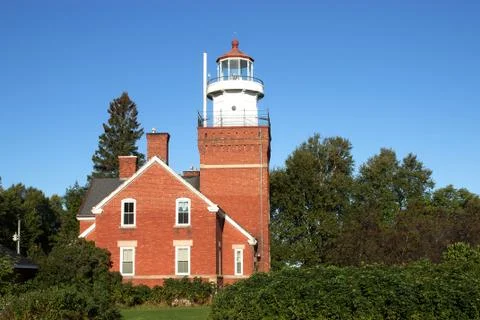 Vintage brick lighthouse Stockfoto's