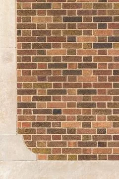 Vintage brown brick wall texture background with white stone moulding Stock Photos