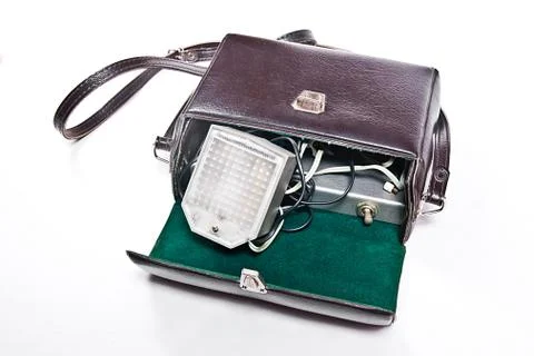 Vintage camera flash isolated on white. Stock Photos