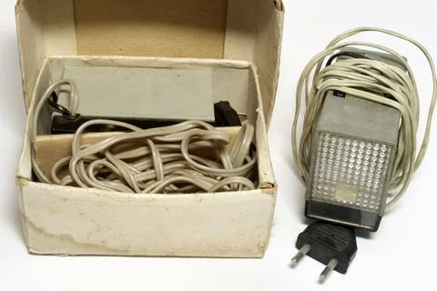 Vintage camera flash unit in a box. old electronic impulse device for photo.. Stock Photos