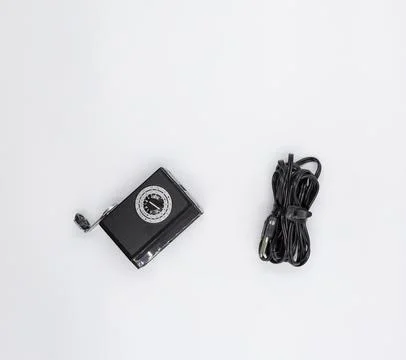 Vintage camera flash unit with coiled sync cord Stock Photos