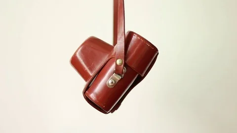 Vintage camera hanging in case Stock Footage 77024556