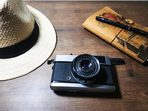 Vintage camera with a hat and notebook Stock Photos