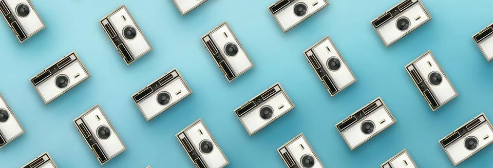 Vintage camera pattern on blue background. Stock Photos
