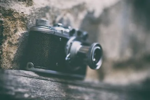 Vintage camera on wall background Stock Photos