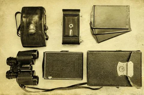 Vintage cameras with cases on a light background Stock Photos