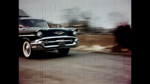 Vintage car driving by Stock Footage