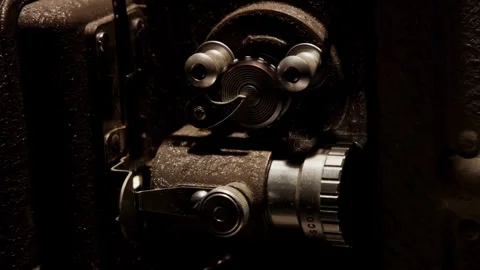 Vintage cinema projector mechanical parts and lens close up Stock Footage 329751253