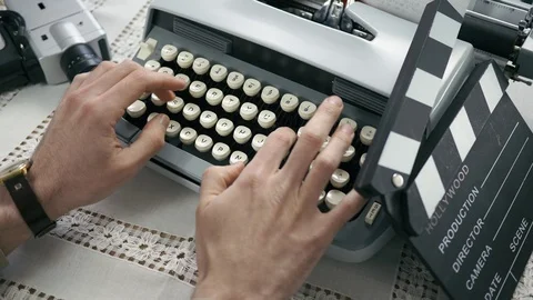 Vintage Cinematographer Typing Script on Typewriter Machine Stock Footage 108563230