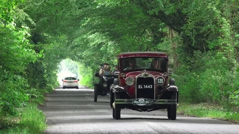 Vintage Classic Car Driving Down A Leafy Stock Video Pond5