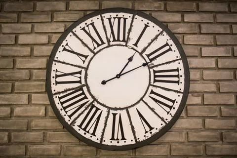 Vintage clock on brick wall Stock Photos