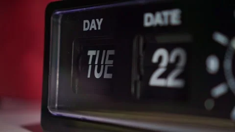 Vintage clock display flipping to new day and date close up, dim light, time Stock Footage 346222047