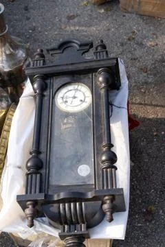 Vintage clock with a pendulum at the fair Stock Photos