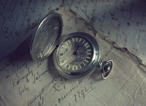Vintage clock on a retro document Stock Photos