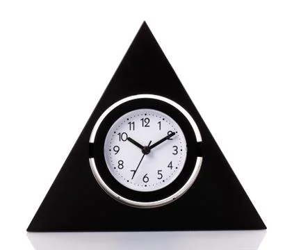 Vintage clock on the white surface background Stock Photos