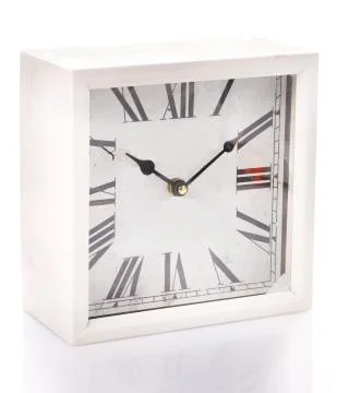 Vintage clock on the white surface background Stock Photos