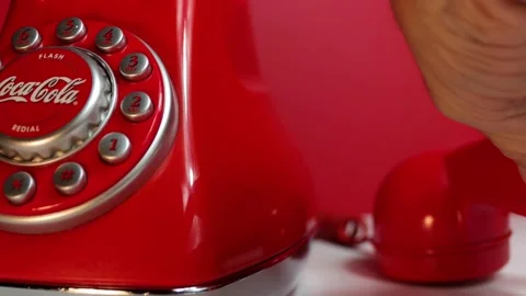 Vintage Coca Cola Red Push Button Land Line Phone post 2000 close up hanging  Stock Footage 164410313