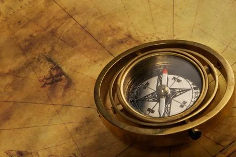 Vintage compass on the old map Stock Photos