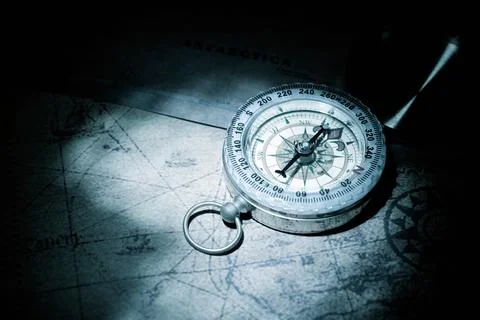 Vintage compass on an old paper map Stock Photos