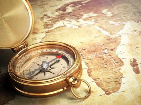 Vintage compass on the old world map. Travel concept. Stock Illustration
