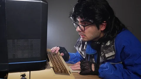 Vintage Computer Geek in the 80s Typing Stock Footage 126474245