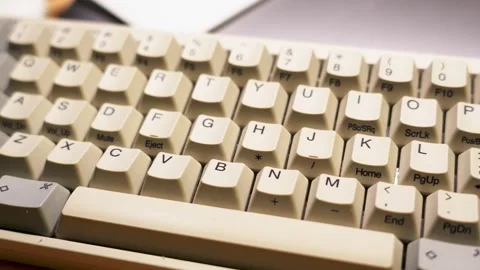 Vintage Computer Keyboard in Warm Light Stock Footage 257397551