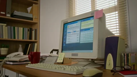Vintage Computer on Office Desk Displaying Retro Software Interface Stock Footage 341419685
