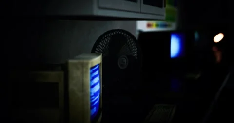 Vintage computer setup illuminated in a dimly lit room with retro decor Stock Footage 316215909