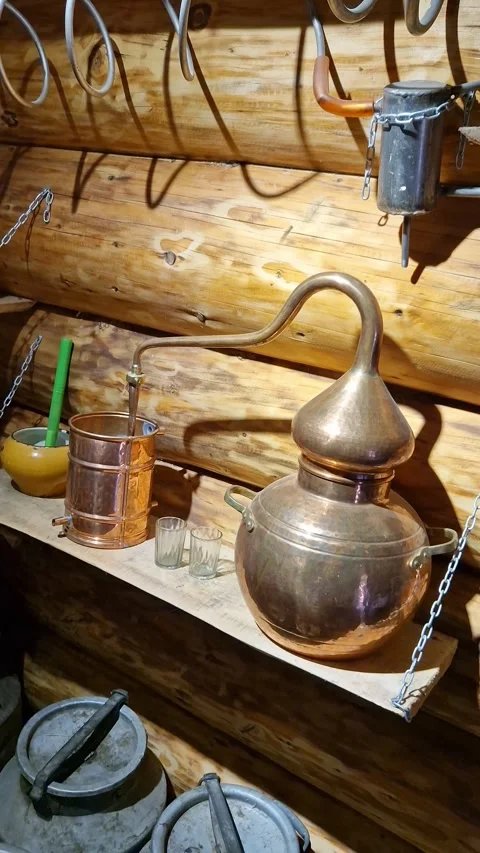 Vintage Copper Alembic Still in Rustic Log Cabin Stock Footage 318353824