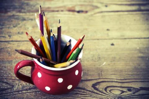 Vintage crayons in the red cup Stock Photos