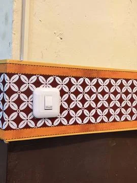 Vintage Decorative Wall Pattern with Electrical Switch Detail Stock Photos