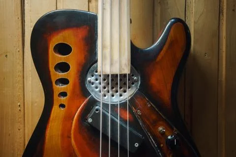 Vintage design of an old four-string bass guitar Stock Photos