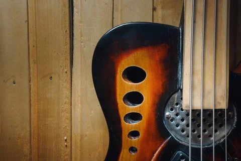 Vintage design of an old four-string bass guitar Foto stock
