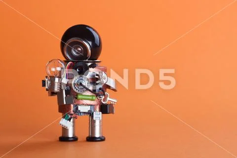 Vintage design robot character with lamp bulb. Circuits socket chip toy Stock Photos