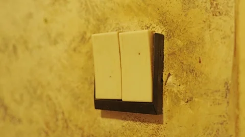 Vintage Double Light Switch on Worn Textured Wall in Retro Home Interior Stock Footage 340981435
