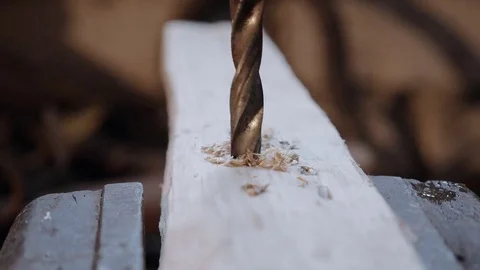 Vintage drill bit drilling a hole in a board, close up Stock Footage 74065963