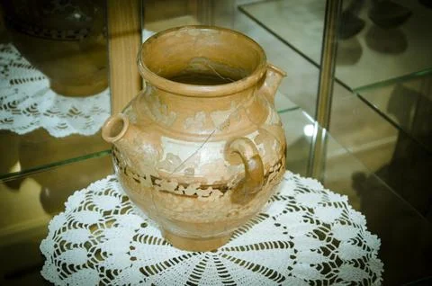 Vintage earthenware pot on the table in the museum Stock Photos
