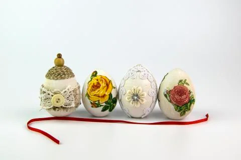 Vintage Easter egg with red ribbon on a white background Stock Photos