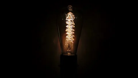 Vintage Edison Bulb Flickering Light Loop Dark Background Stock Footage 340298214