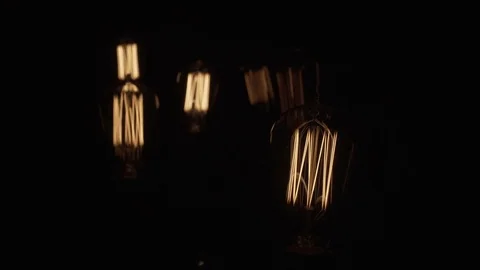 Vintage Edison Light Bulb On Black Slide In 動画素材 71334992