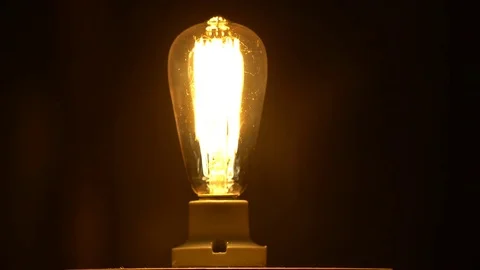 Vintage Edison Light Bulb Brighten Stock Footage