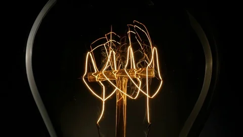 Vintage Edison light bulb flickering. 4K, UHD Video stock 73376985