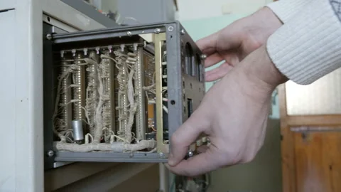 Vintage electronic device in protective case. Engineer conducts maintenance work Stock Footage 91575082