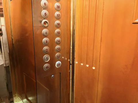 Vintage Elevator Control Panel with Wooden Interior Foto stock